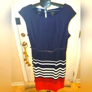 Sheath sleeveless dress with a blue belt. Colors blue, white, and red.
